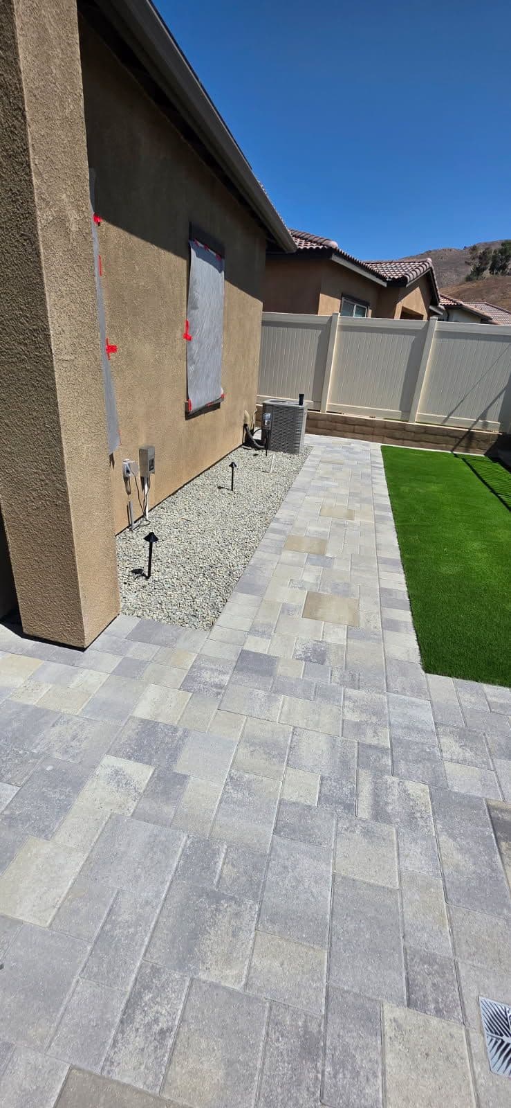Stunning Side Yard Transformation with Pavers and Turf image