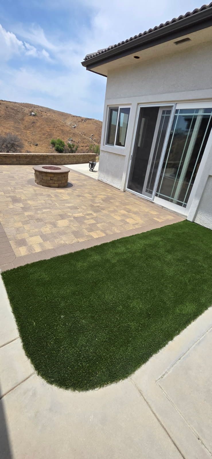 Modern Patio with Elegant Stonework and Fire Pit
